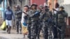 FILE - Members of the Mozambique military patrol the streets of the capital amid violence sparked by the election outcome, in Maputo, Mozambique, Nov. 8, 2024. Tens of thousands of Mozambicans have fled the country to escape the political unrest. 