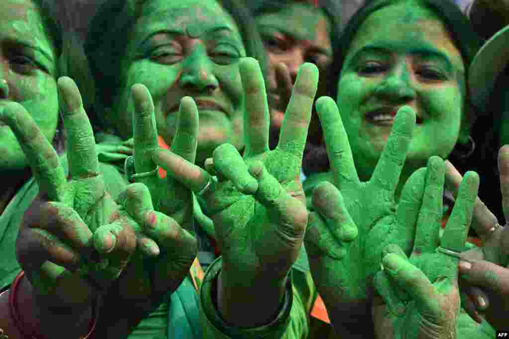 Supporters of the Trinamool Congress (TMC) celebrate the party's victory in the Kolkata Municipal Corporation (KMC) elections, in Kolkata, India.