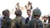 Syria's President Bashar al-Assad, center, chats with military personnel during visit to military site in Daraya,Aug. 1, 2013, SANA handout photo.