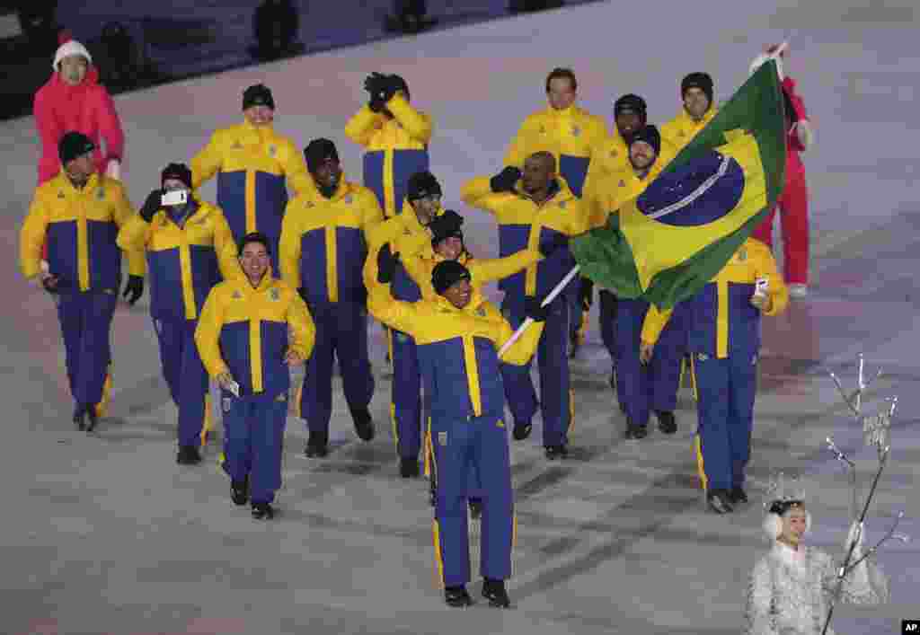 Edson Bindilatti carries the flag of Brazil during the opening ceremony of the 2018 Winter Olympics in Pyeongchang, South Korea, Feb. 9, 2018.