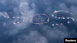 Commercial fishermen, mariners form "SOS" to spread message of saving oceans from acidification caused by fossil fuel emissions, Homer, Alaska, Sept. 6, 2009.