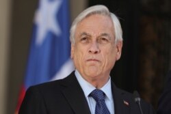 FILE - Chile's President Sebastian Pinera addresses the nation in Santiago, Oct. 24, 2019.