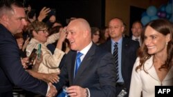 This picture taken on Oct. 14, 2023 shows New Zealand's National party leader Christopher Luxon interacting with his supporters after winning the 2023 New Zealand general election, during a party event in Auckland.