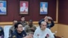 FILE - In this image provided by the Royal Thai Police, Chinese actor Wang Xing, right, talks with Thai police officers in Mae Sot district, in Thai-Myanmar border, Tak province Jan. 7, 2025.