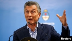 Argentina's President Mauricio Macri gestures during a news conference at the Olivos Presidential Residence in Buenos Aires, May 16, 2018.