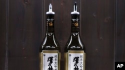 Bottles of Sawanoi, a Japanese sake brand by Ozawa Sake Brewery, are prepared for tasting at a room during a media tour at the brewery in Ome, on the western outskirts of Tokyo, Nov. 13, 2024.