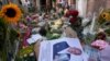 His picture and flowers mark the spot where journalist Peter R. de Vries was shot earlier last week in Amsterdam, Netherlands, July 8, 2021.