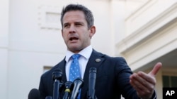 FILE - Rep. Adam Kinzinger, R-Ill., speaks to the media at the White House in Washington, March 6, 2019. 