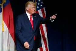 FILE - Former President Donald Trump acknowledges the crowd as he speaks at the North Carolina Republican Convention, June 5, 2021, in Greenville.