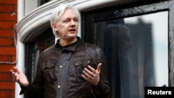 FILE - WikiLeaks founder Julian Assange is seen on the balcony of the Ecuadorian Embassy in London, Britain, May 19, 2017.