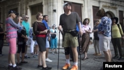 American tourists look around during a tour of old Havana, Cuba, Dec. 14, 2015.