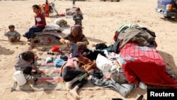 People displaced in fightings between the Syrian Democratic Forces and Islamic State militants are pictured at a refugee camp in Ain Issa, Syria, Oct. 14, 2017.