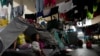 Indígenas emberá desplazados por años de conflicto armado interno y condiciones de vida precarias en la región central occidental de Colombia sentados dentro de un refugio después de viajar a Bogotá, el jueves 28 de noviembre de 2024. 