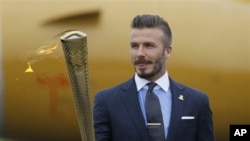 Beckham berharap bisa terpilih memperkuat kesebelasan Inggris dalam Olimpiade London (foto, 18/5/2012). 