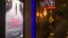A movie-goer is checking his phone await the screening of “First They Killed My Father” at Major Cineplex Cinema, Phnom Penh, Cambodia, on September 21st, 2017. (Khan Sokummono/VOA Khmer) 