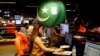 An employee works at the control room of the Geo News television channel in Karachi, Pakistan, April 11, 2018. 