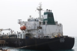 FILE - Iranian oil tanker Fortune is anchored at the dock of the El Palito refinery near Puerto Cabello, Venezuela, May 25, 2020.