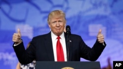 FILE - President Donald Trump gives thumbs up as he arrives to speak at the Conservative Political Action Conference, Feb. 24, 2017, in Oxon Hill, Maryland.