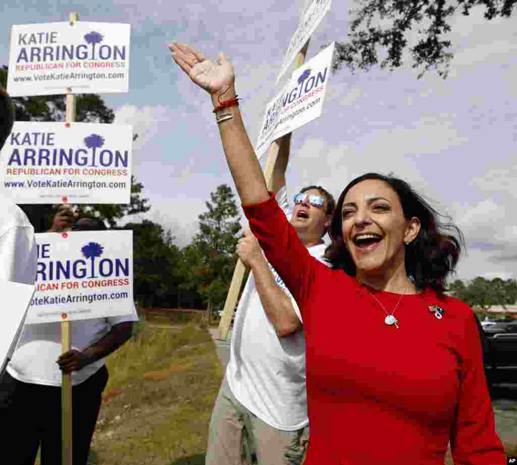 Republican nominee for Congress Katie Arrington waves to voters with other supporters at Westview Primary Schools in Goose Creek, S.C., Nov., 6, 2018.