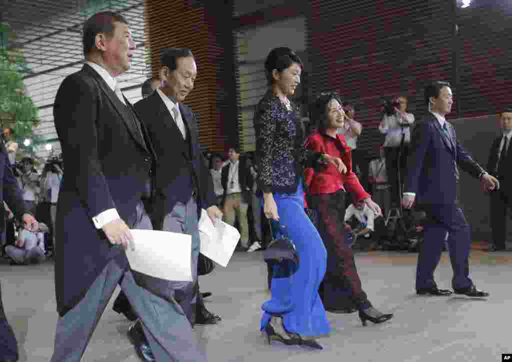 Newly appointed ministers leave the prime minister's office for the Imperial Palace for the attestation ceremony in Tokyo, Sept. 3, 2014.