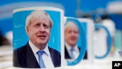 Mugs with a mug shot portrait of Boris Johnson are one sale at the annual Conservative Party Conference in Manchester, England, Sept. 29, 2019. 