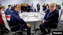 French President Emmanuel Macron and President Donald Trump participate in a G-7 Working Session on the Global Economy, Foreign Policy, and Security Affairs at the G-7 summit with German Chancellor Angela Merkel, Canadian Prime Minister Justin Trudeau.