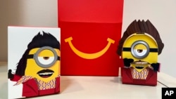 A cardboard McDonald’s Happy Meal toy is shown with a Happy Meal box on Sept. 20, 2021.