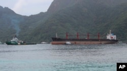 The North Korean cargo ship, Wise Honest, right, was towed into the Port of Pago Pago, May 11, 2019, in Pago Pago, American Samoa.