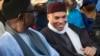 Karim Wade (R), son of Senegal's former president Abdoulaye Wade, attends a rally by his father's political party Parti Democratique Senegalais (PDS) in Dakar, Dec. 6, 2012. 