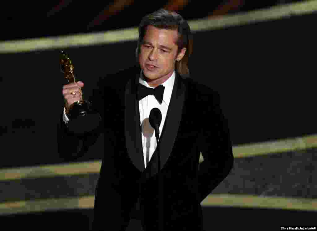 Brad Pitt accepts the award for best performance by an actor in a supporting role for "Once Upon a Time in Hollywood" at the Oscars at the Dolby Theatre in Los Angeles, Feb. 9, 2020.
