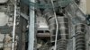 A derailed New Jersey Transit train is seen under a collapsed roof after it derailed and crashed into the station in Hoboken, New Jersey, Sept. 29, 2016. 