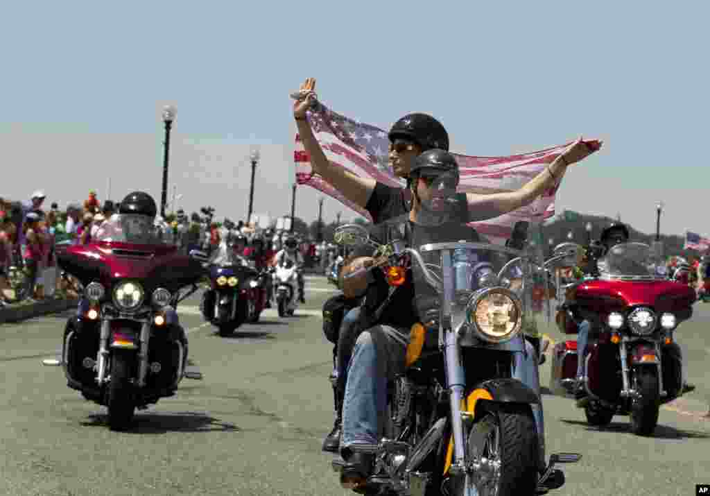 Participants in the Rolling Thunder annual motorcycle rally ride past Arlington memorial bridge during the parade on Memorial Day in Washington, May 24, 2015. 