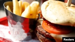 The World Health Organization said Friday that adults and children should limit their intake of saturated fat — found in foods such a meat — and trans fat — found in foods such as french fries. 