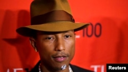 FILE - Pharrell Williams arrives at the Time 100 gala celebrating the magazine's naming of the 100 most influential people in the world for the past year, in New York, April 29, 2014.