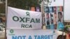 Une affiche des humanitaires dans une rue de Bangui, 19 août 2017. (VOA/Freeman Sipila)