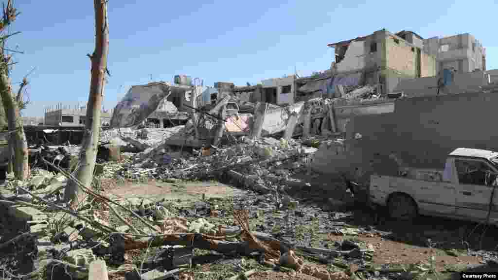 The aftermath of an explosion in Al-Salam Square carried out by an IS truck rigged with explosives, Kobani, Syria, Oct. 22, 2014. (Shirwan Qasim / Transterra Media)