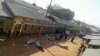 FILE - People gather at the scene of an attack in the town of Mandera, Kenya, near the border with Somalia, Oct. 25, 2016. 