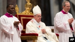 Pope Francis celebrates Mass in St. Peter's Basilica at the Vatican, Jan. 1, 2014.