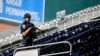 Police check out a vacated stadium after a game was postponed due to gunfire outside the stadium at Nationals Park, Washington, D.C., Jul 17, 2021. (Brad Mills-USA Today Sports)
