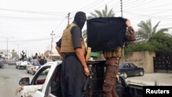 "Iroq va Shom islomiy davlati" guruhi jangarilari, Mosul, Iroq, 12-iyun, 2014-yil.
