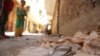 A blood-stained sandal is seen in front of a house, where four Egyptian Shi'ites were killed, in the suburb of Zawiyat Abu Musallem, on the outskirts of Cairo, June 24, 2013.