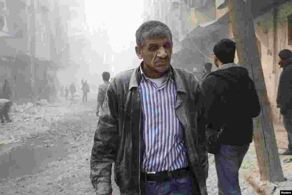 Isyonchilarning aytishicha, prezident Bashar al-Assad kuchlari Halabning al-Shaar tumanini bombardimon qilgan. 9-fevral, 2014-yil.