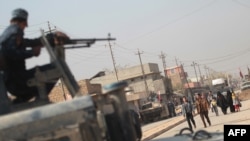 Iraqi forces patrol the Hammam al-Alil area, about 14 kilometers from the southern outskirts of Mosul, Nov. 7, 2016, after recapturing it from Islamic State jihadists during the ongoing operation to retake Mosul. 