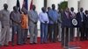 This picture released by the Kenya presidential service shows Kenyan President Uhuru Kenyatta speaking during a press conference with the seven detainees released to his custody by South Sudan President after addressing a press conference at State House in Nairobi, Jan. 29, 2014. 
