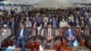 FILE - Somalia’s President Mohamed Abdullahi Mohamed (R) attends a closing ceremony after reaching an agreement with state leaders over the terms of a new election, at the National Consultative Council on Elections in Mogadishu, May 27, 2021.