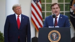 In this March 30, 2020, file photo, My Pillow CEO Mike Lindell speaks as President Donald Trump listens during a briefing about the coronavirus in the Rose Garden of the White House, in Washington. (AP)