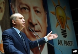 Turkey's President Recep Tayyip Erdogan addresses the members of his ruling party in Ankara, Turkey, Oct. 13, 2017. Analysts say the most recent incursion by Turkish troops into Syria is part of efforts by Moscow, Ankara and Tehran to try to shape the end-game to Syria’s long-running conflict.