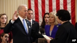 Vice President Joseph Biden, Jr. takes the oath of office, administered by Associate Supreme Court Justice Sonia Sotomayor in the residence of the vice president in Washington, January 20, 2012.