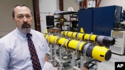 FILE - A pair of unmanned underwater vehicles (UUV) are pictured in a lab at the Naval Undersea War Center in Middletown, R.I.