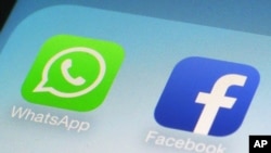 Many refugees and migrants use WhatsApp and Facebook to get and send important information. (AP Photo/Patrick Sison)